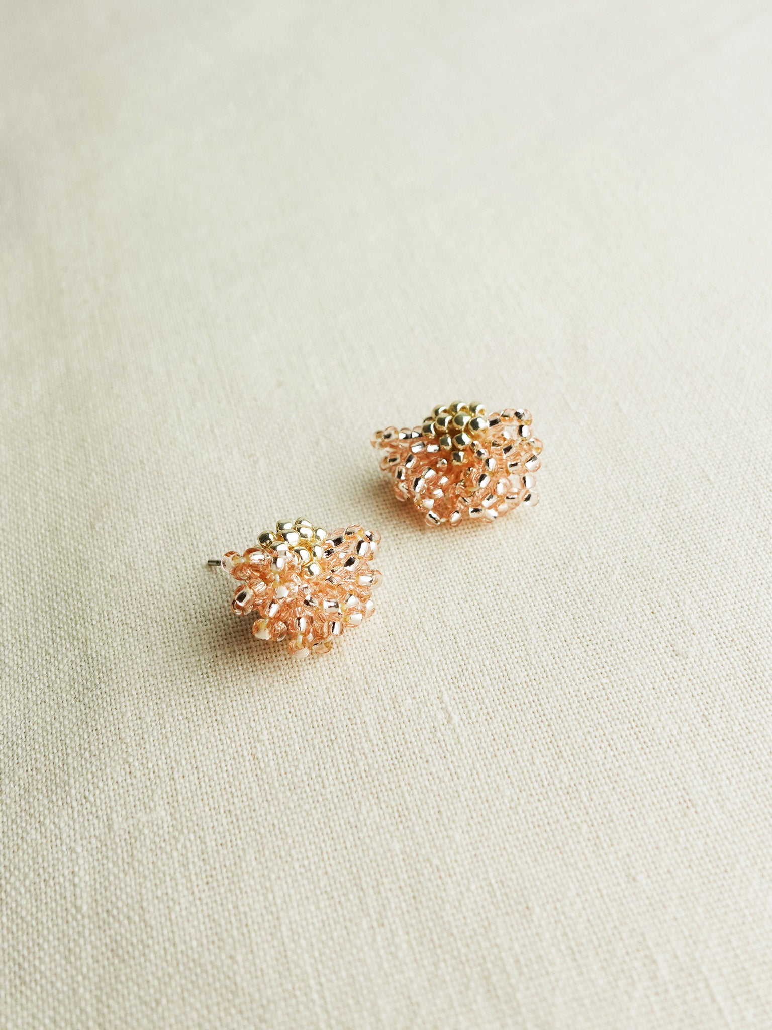 Camellia Stud Earrings in Champagne Pink Left