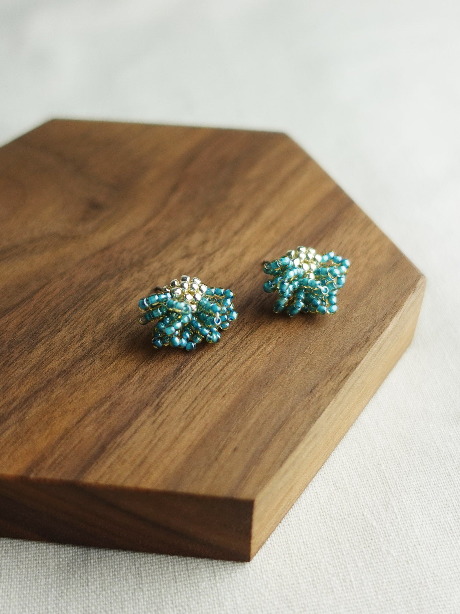 Camellia Stud Earrings in Ocean Green Display Left