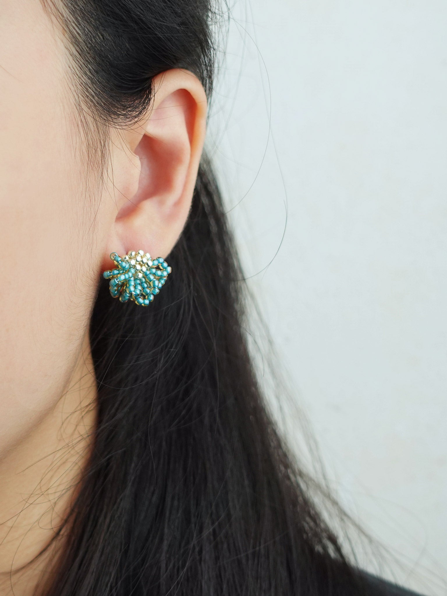 Camellia Stud Earrings in Ocean Green Model