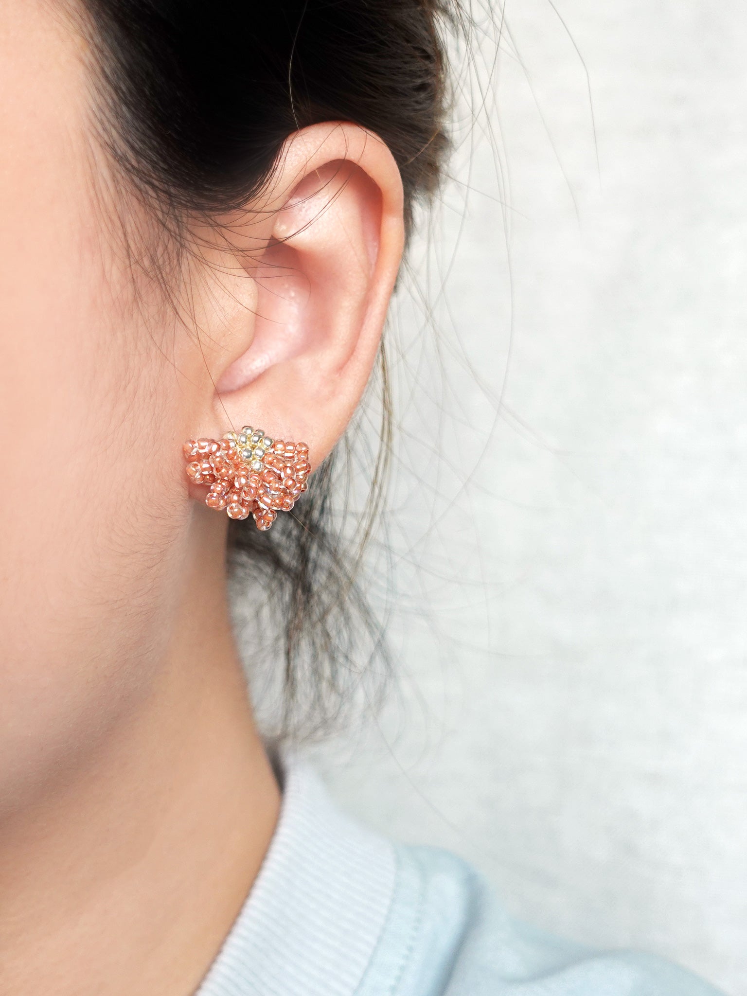 Camellia Stud Earrings in Strawberry Red Model