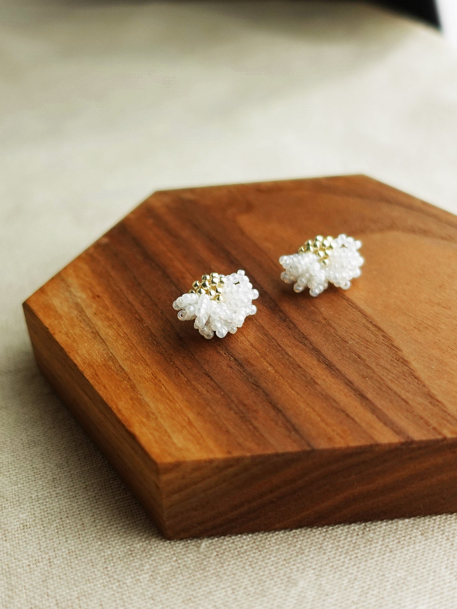 Camellia Stud Earrings in White Display