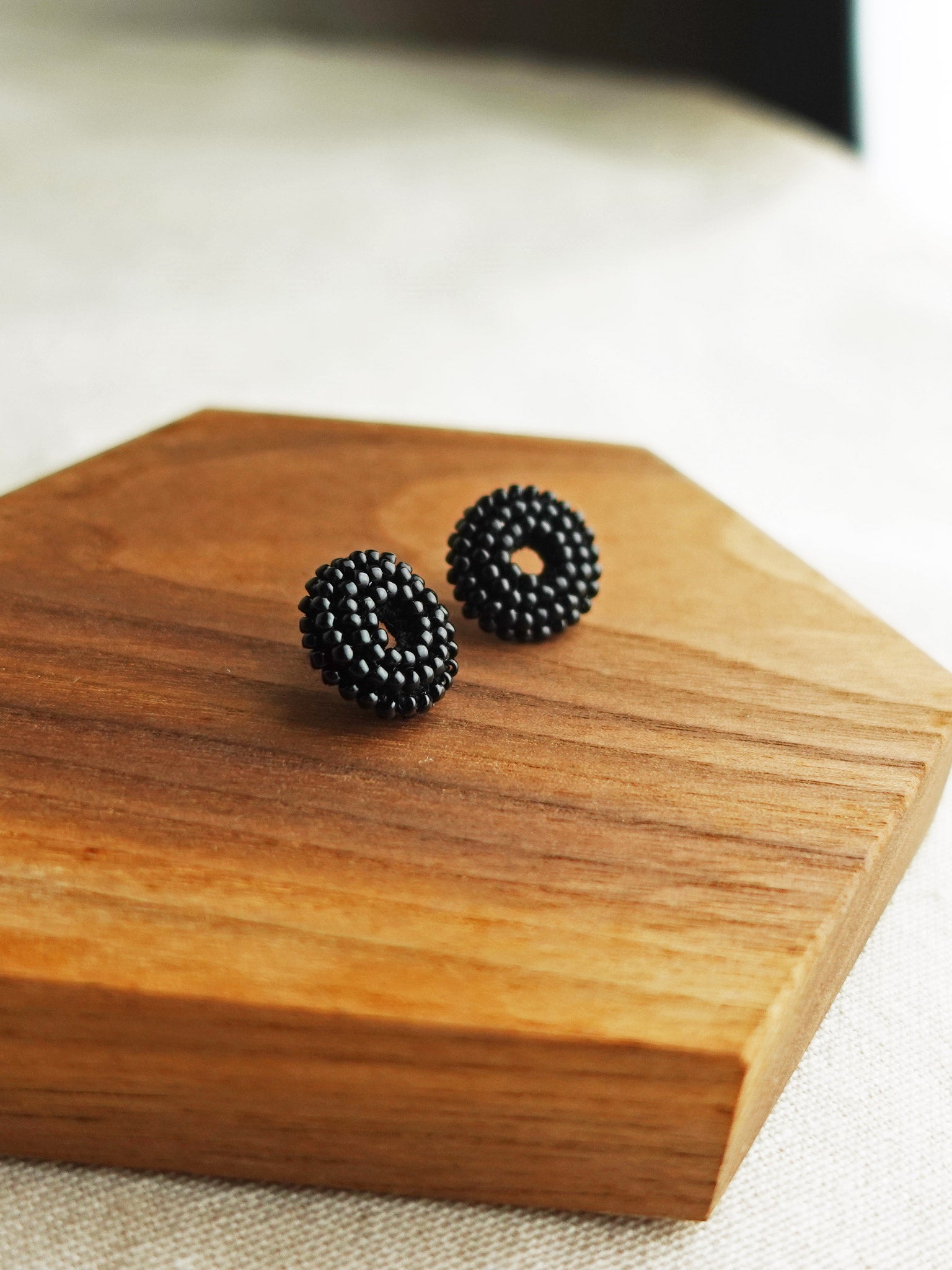 Donut Stud Earrings in Black Display Left