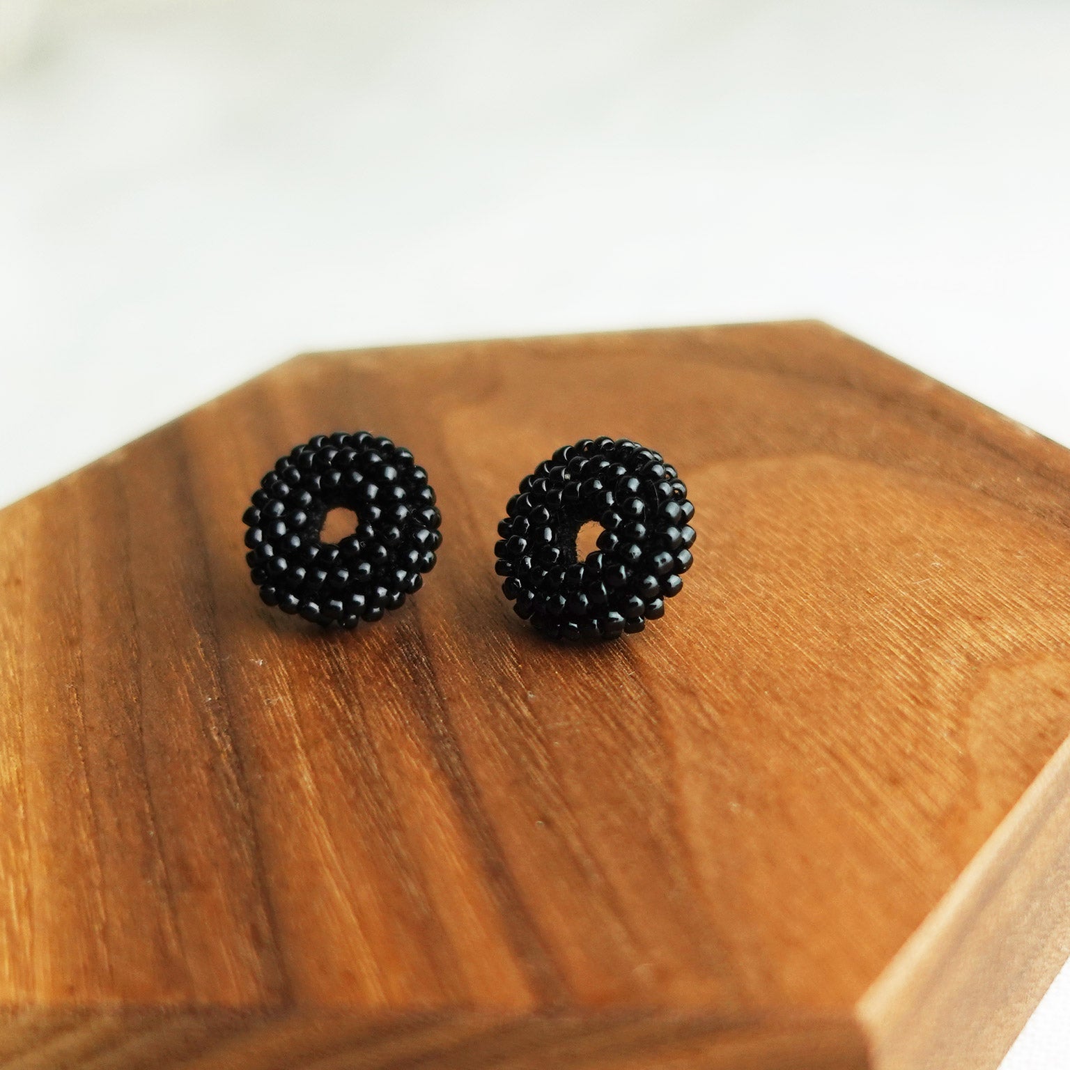 Donut Stud Earrings in Black Display Right