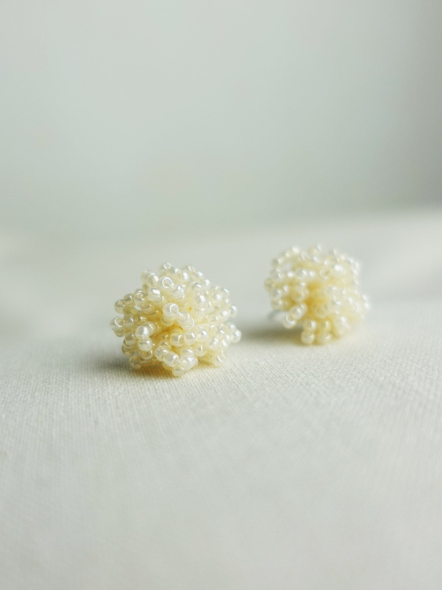 Fluffy Earrings in Ivory Left