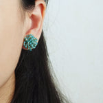 Fluffy Earrings in Ocean Green Model