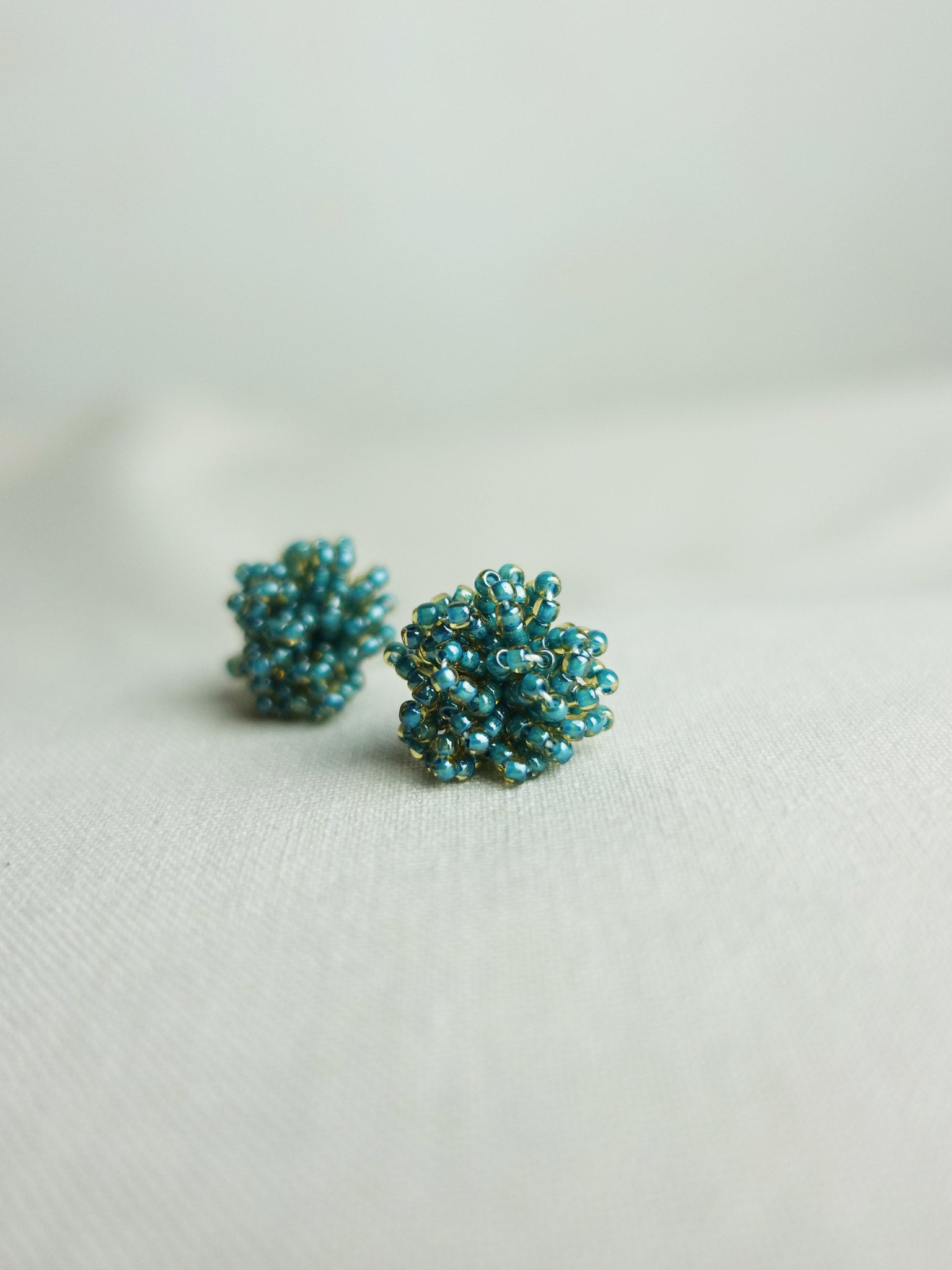 Fluffy Earrings in Ocean Green Right Side