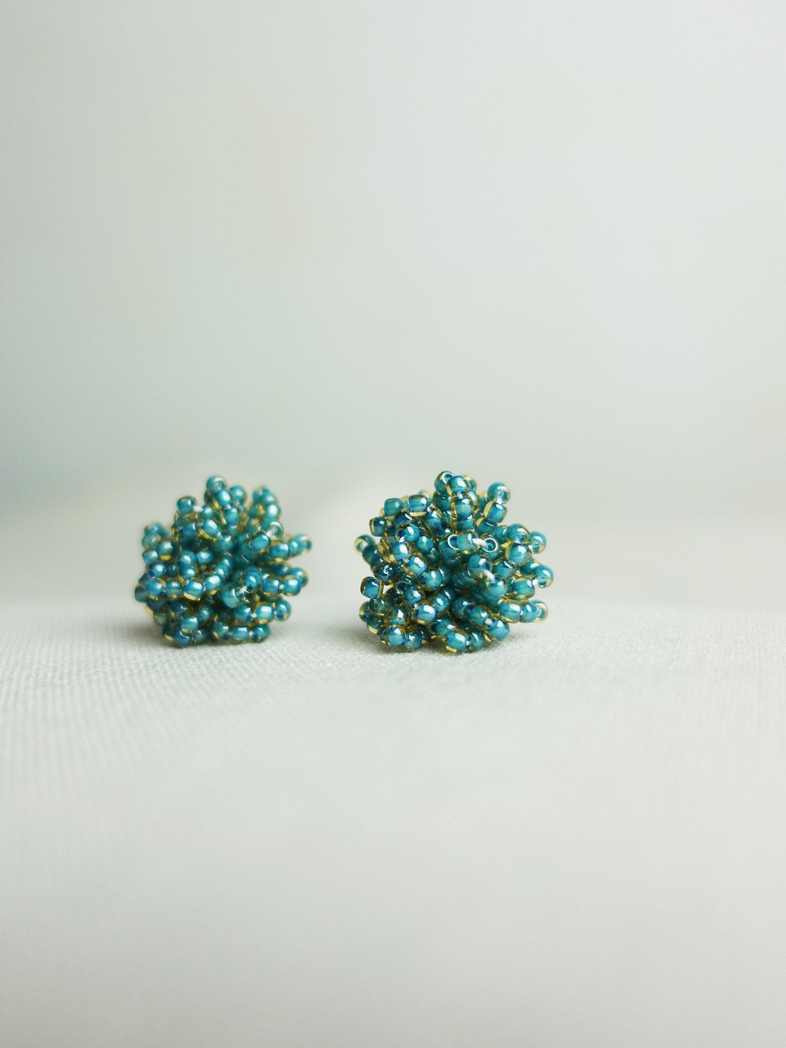 Fluffy Earrings in Ocean Green Right