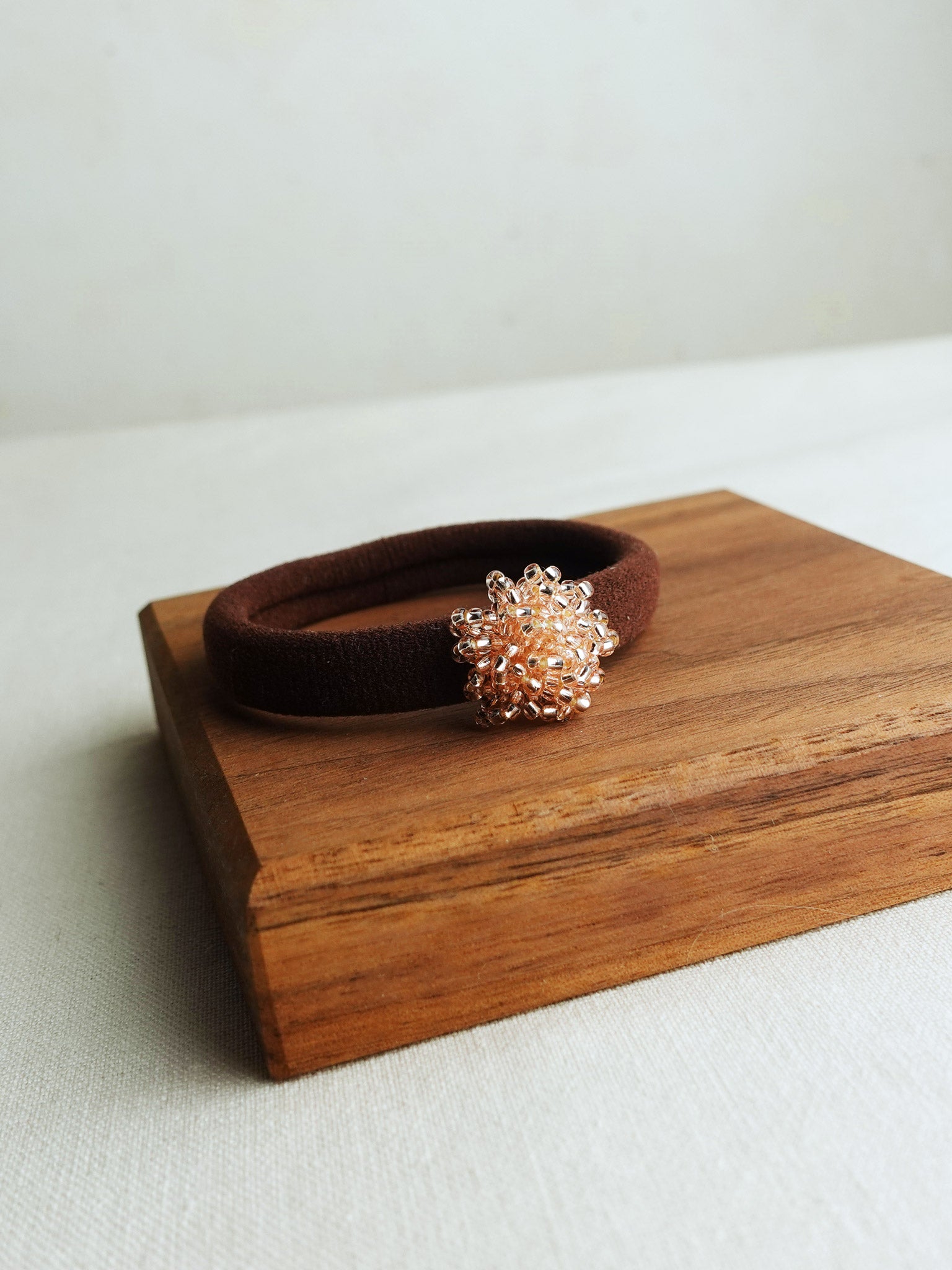 Fluffy Hair Tie in Champagne Pink Display Left