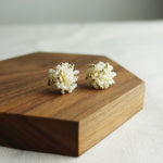 Fluffy Star Dust Earrings in Ivory Display Left