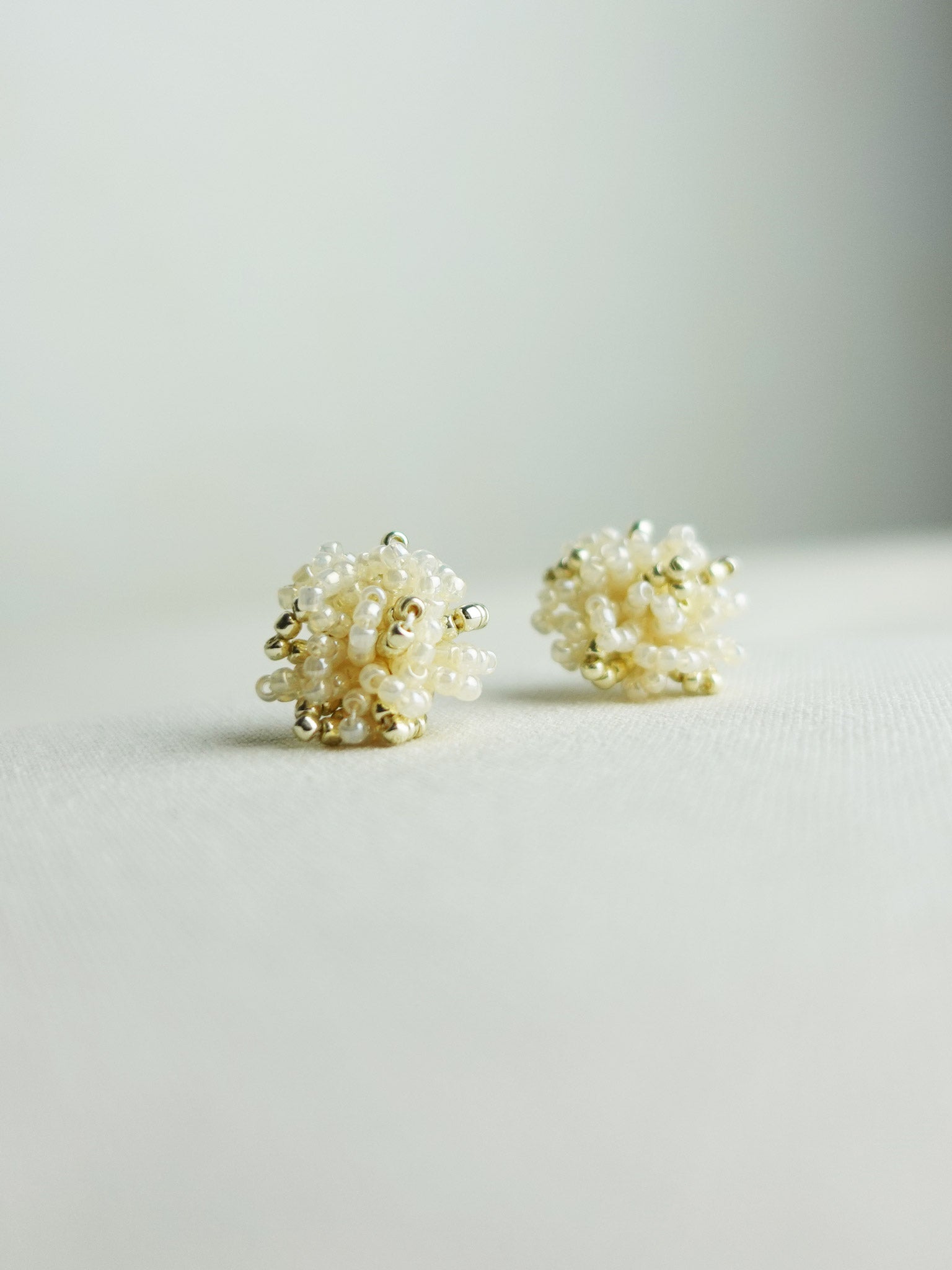 Fluffy Star Dust Earrings in Ivory Front