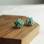Fluffy Star Dust Earrings in Ocean Green Display Left
