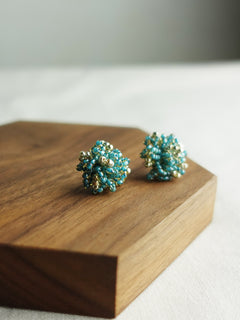 Fluffy Star Dust Earrings in Ocean Green Display Left