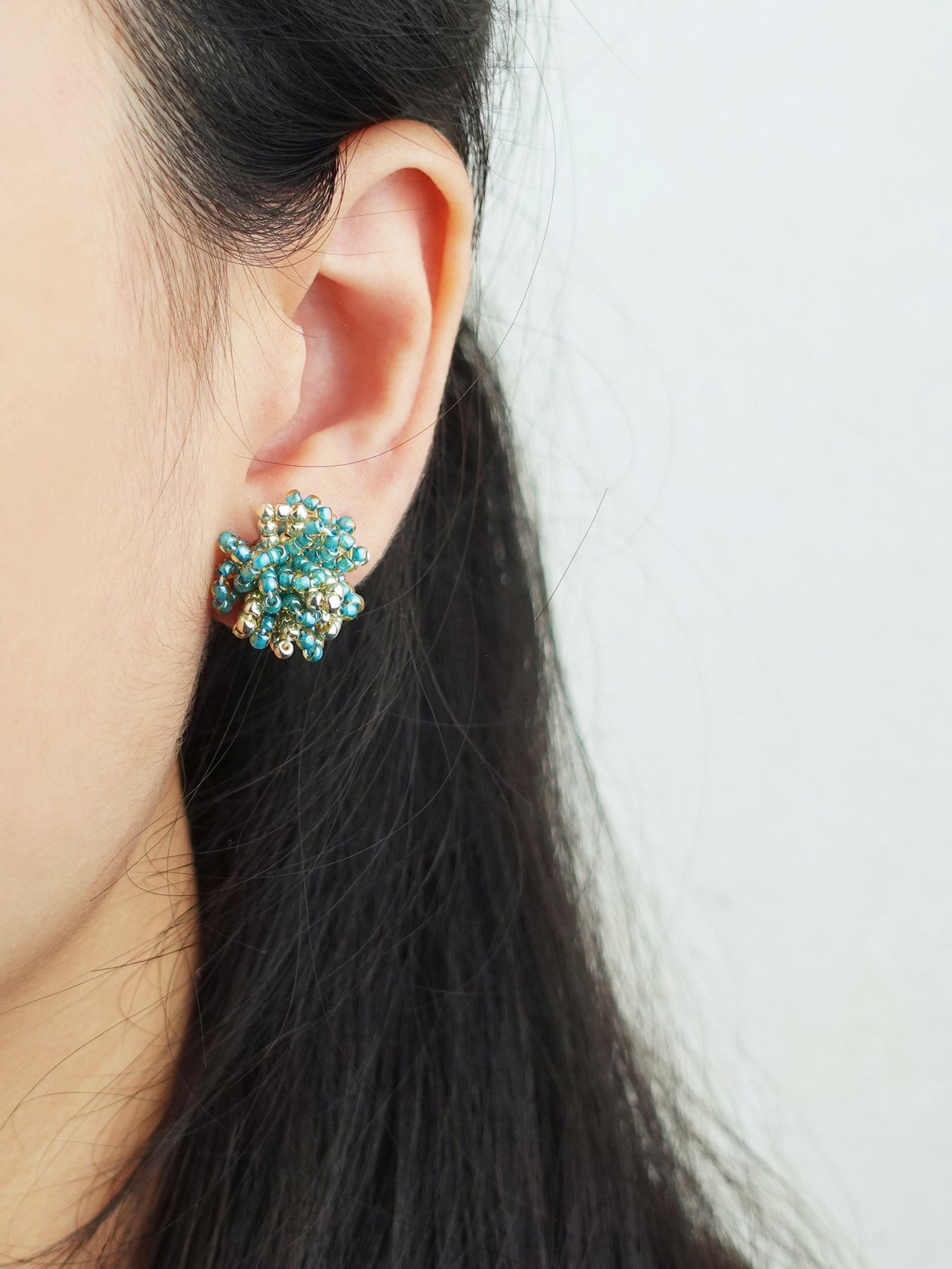 Fluffy Star Dust Earrings in Ocean Green Model