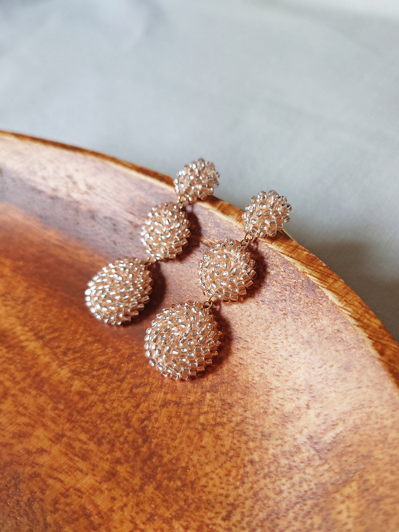 Juno Dangle Earrings in Champagne Pink Display Side
