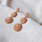 Juno Dangle Earrings in Champagne Pink Side