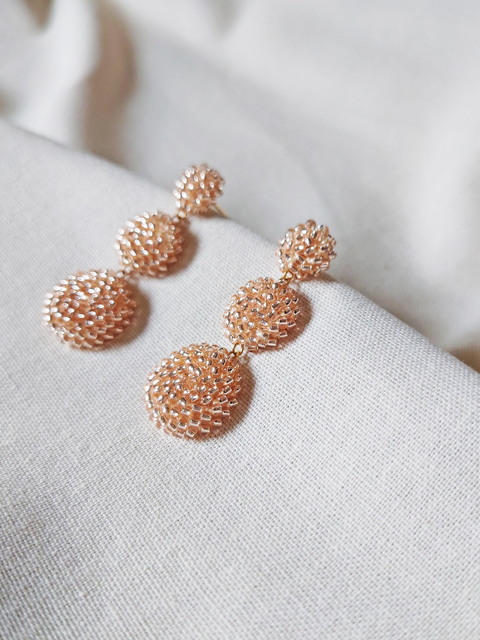 Juno Dangle Earrings in Champagne Pink Side