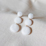 Juno Dangle Earrings in White Front