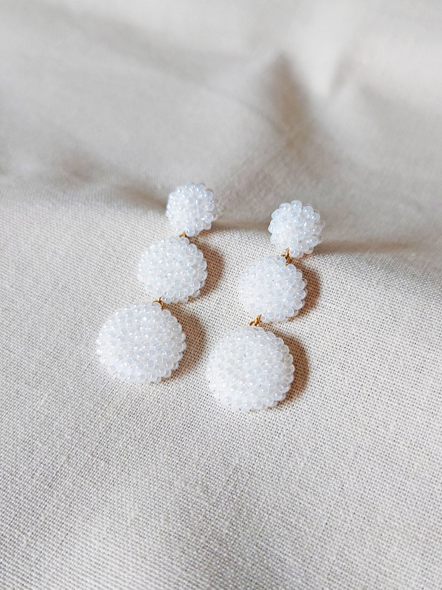 Juno Dangle Earrings in White Front