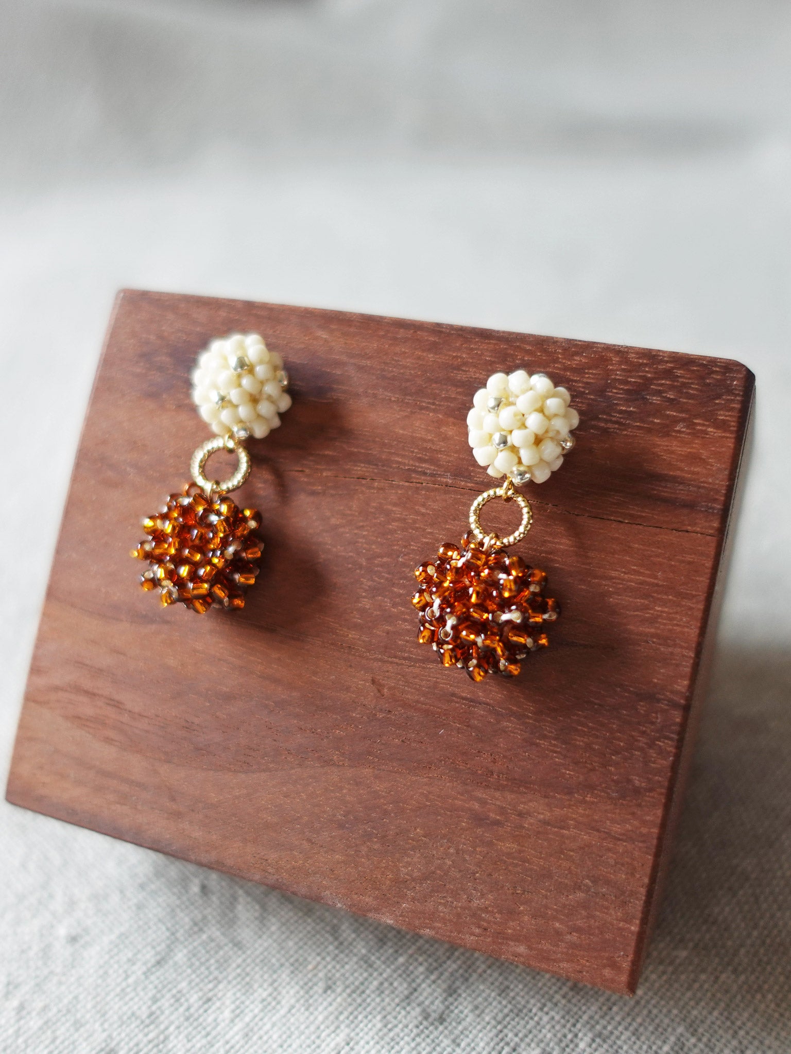 Larissa Stars Earrings in Dark Amber Display