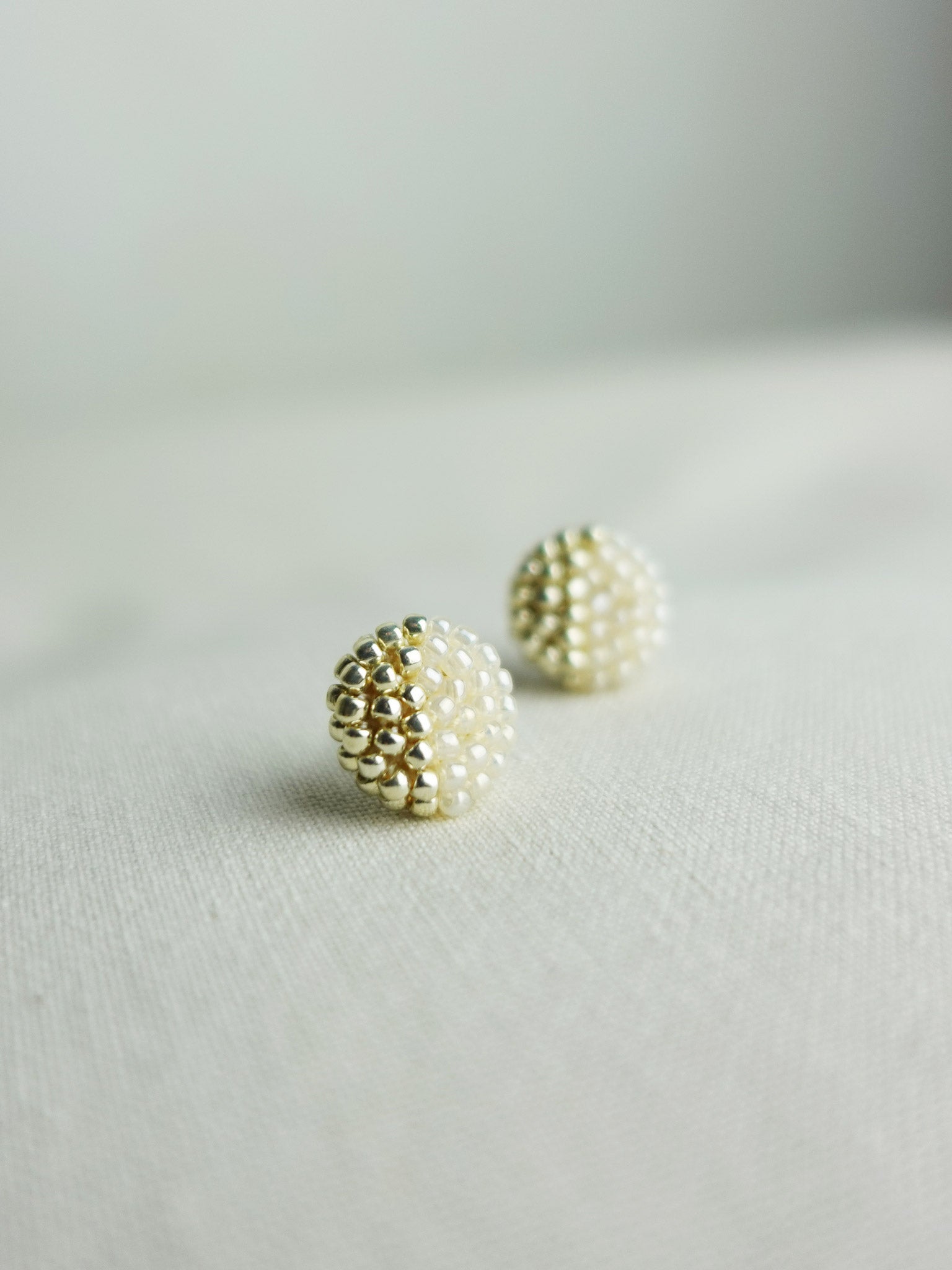 Last Quarter Delica Stud Earrings in Ivory Left