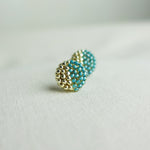 Last Quarter Delica Stud Earrings in Ocean Green Left