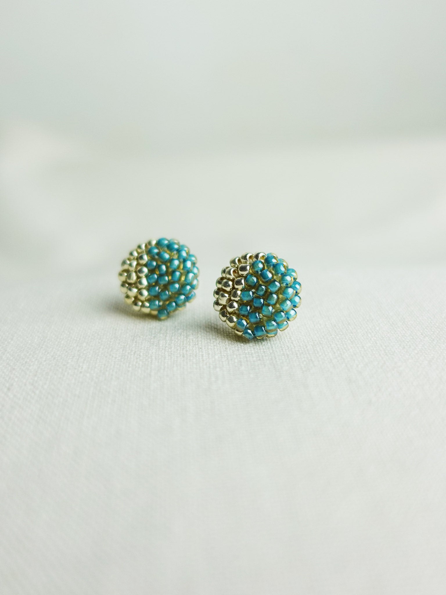 Last Quarter Delica Stud Earrings in Ocean Green Right
