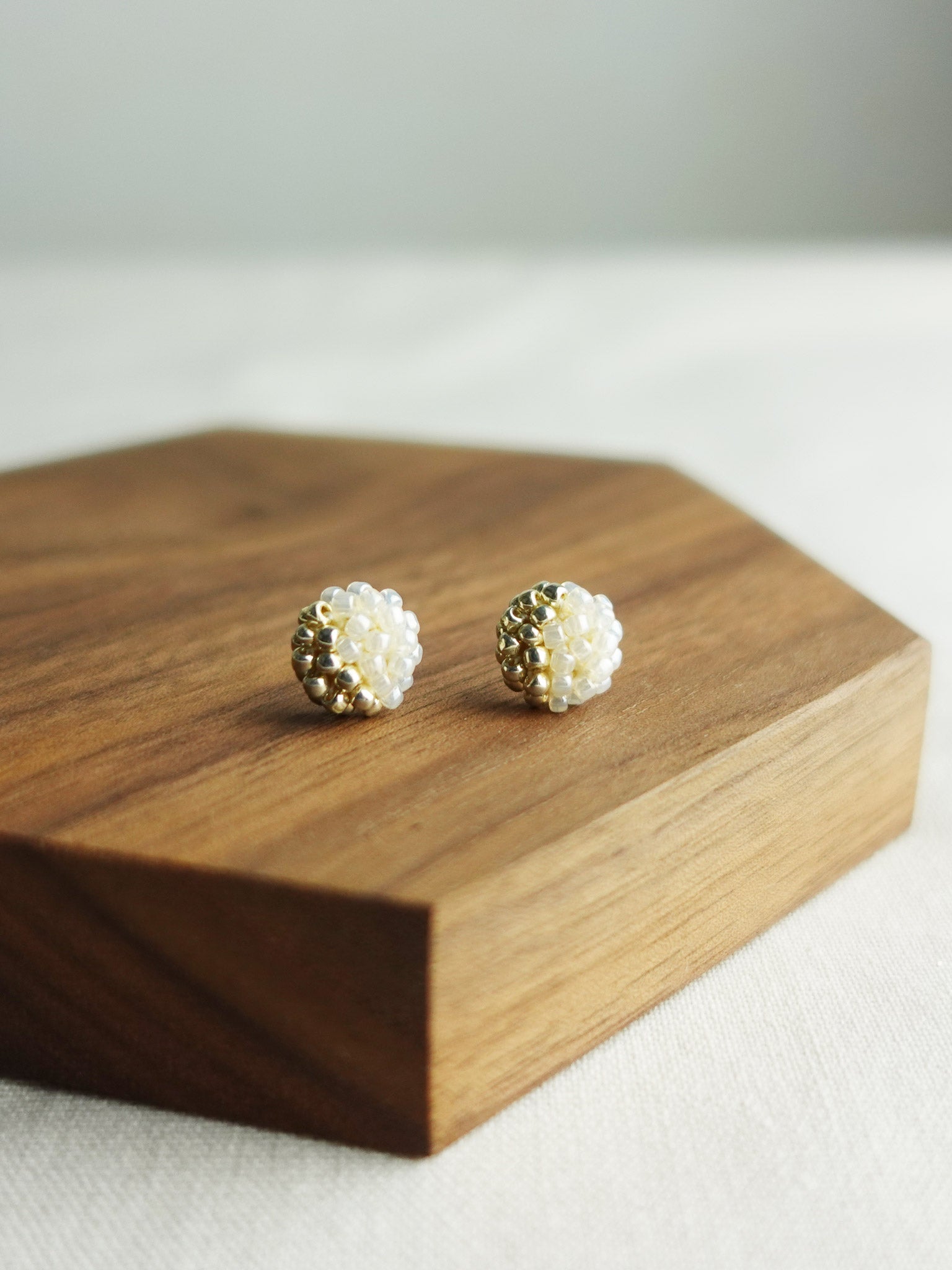 Last Quarter Petite Studs in Ivory Display