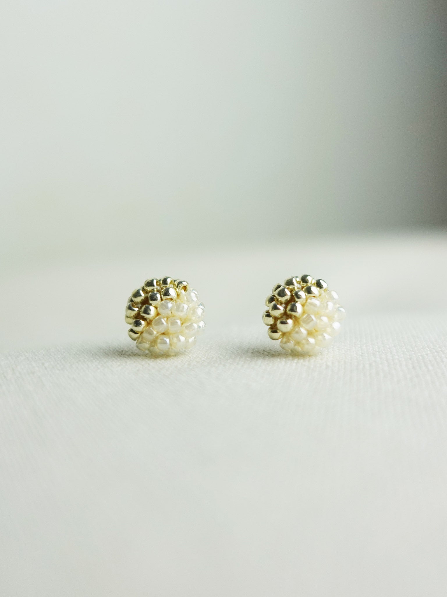 Last Quarter Petite Studs in Ivory Front 1