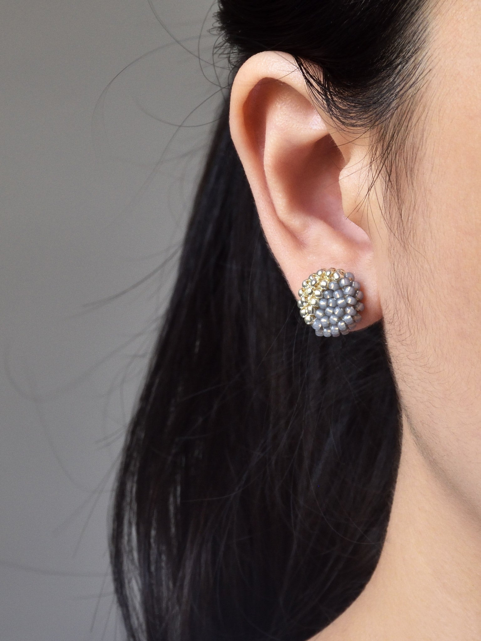 Last Quarter Delica Stud Earrings in Grey Model