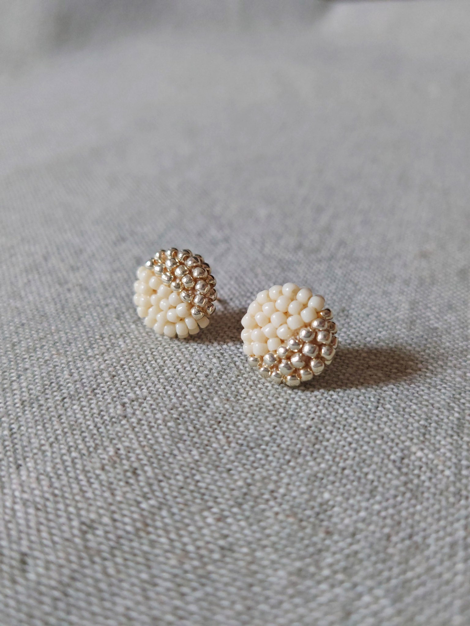 Last Quarter Delica Stud Earrings in Milk White Front