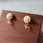 Layna Globe Earrings in Milk White Display