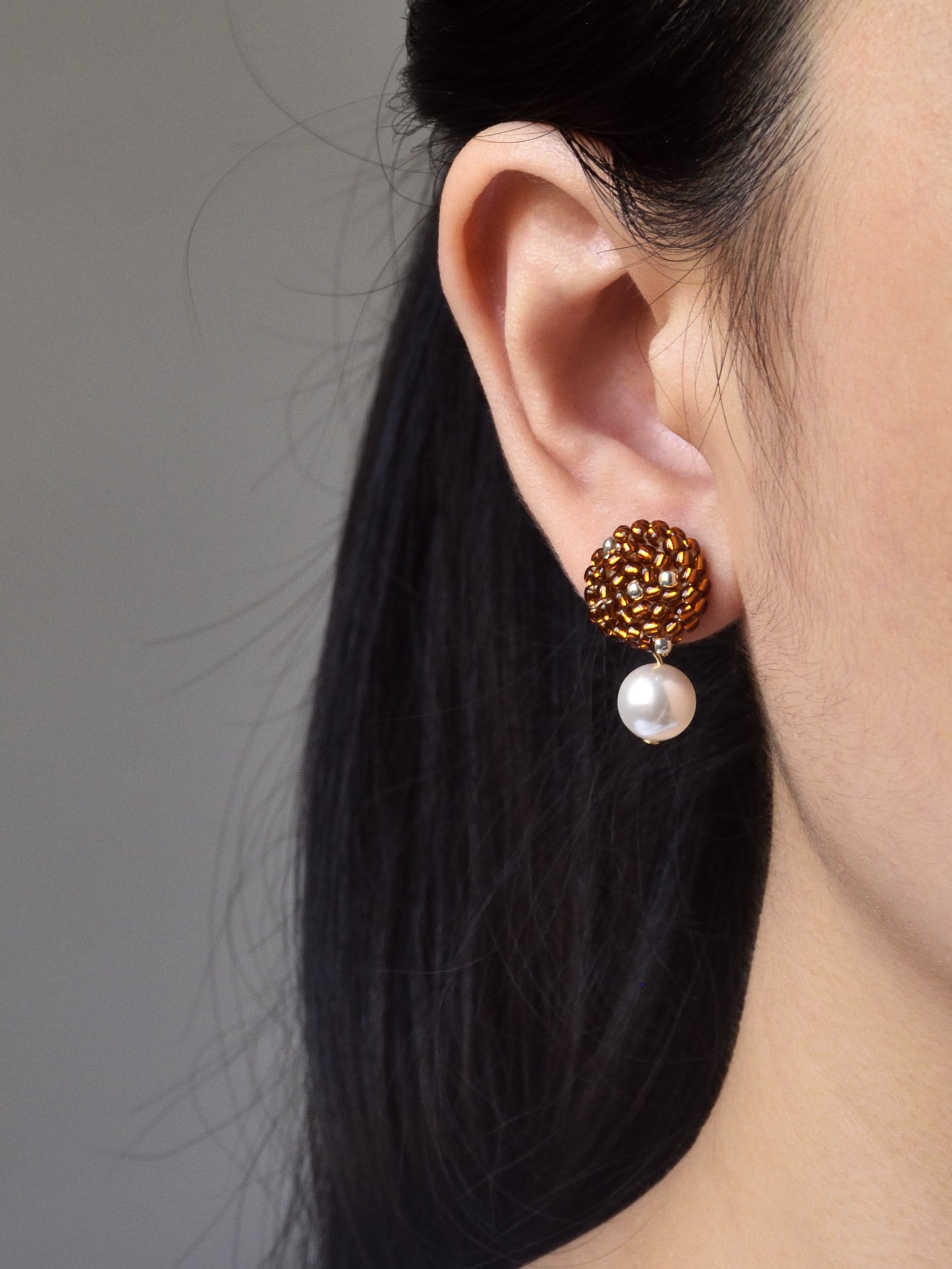 Mariota Drop Earrings in Dark Amber Model
