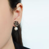 Mariota Drop Earrings in Umber Model