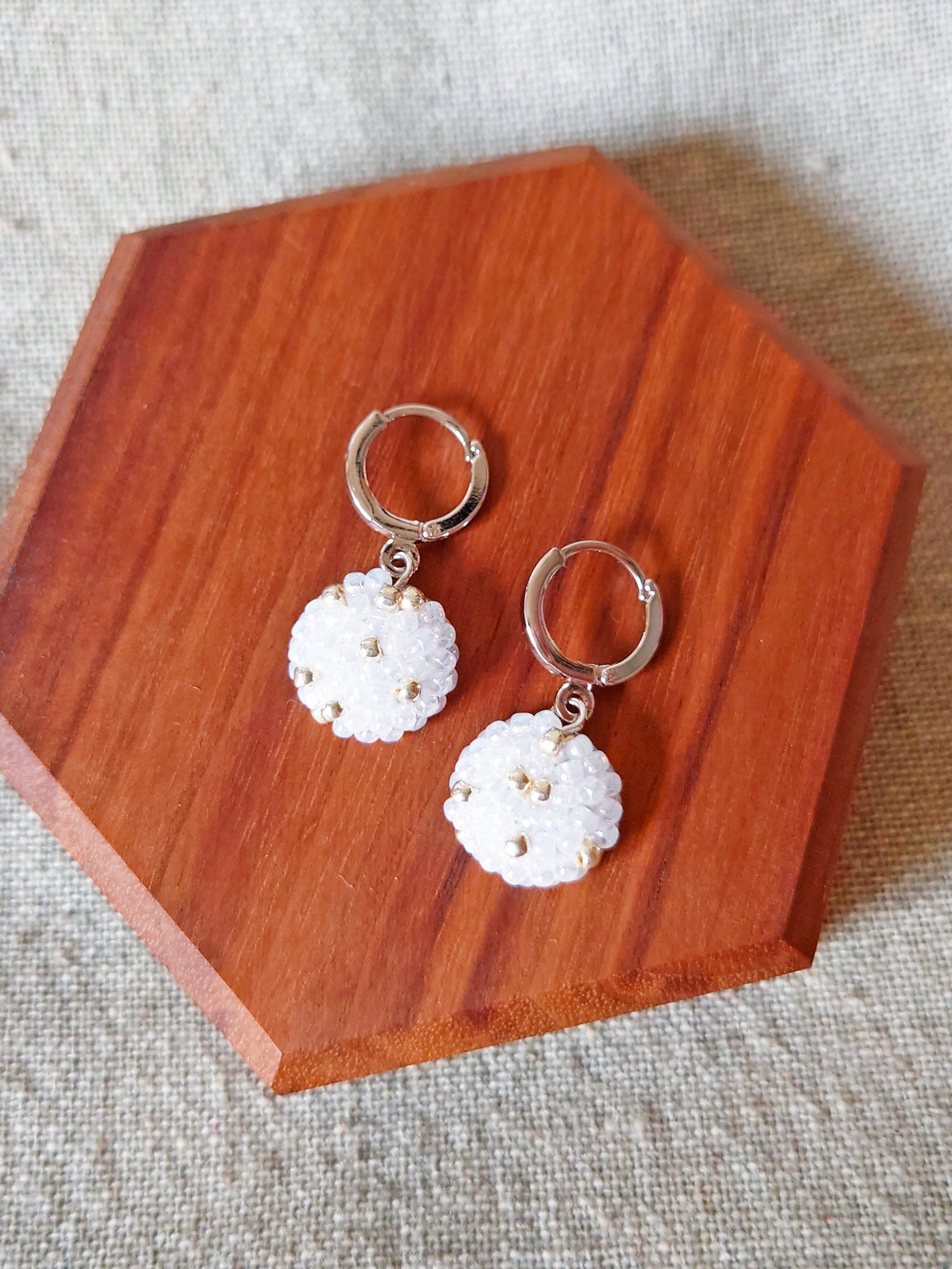 Star Dust Pendant Earrings in White Display Top