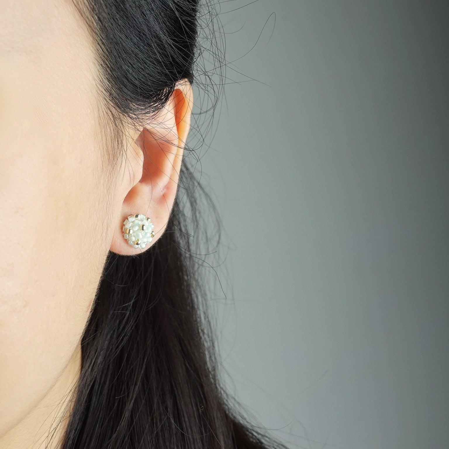 Star Dust Petite Stud Earrings in Mint Green Model