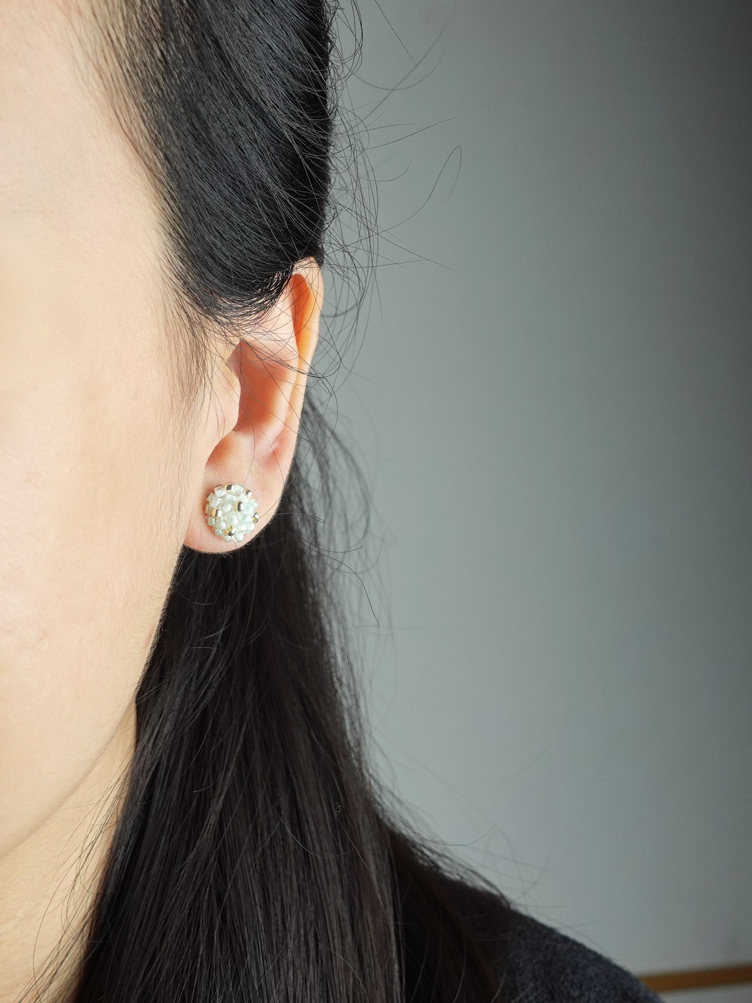 Star Dust Petite Stud Earrings in Mint Green Model