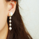 Thea Trio Earrings in Champagne Pink Model