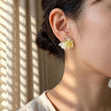 Aurea Bloom Earrings in Yellow on Model