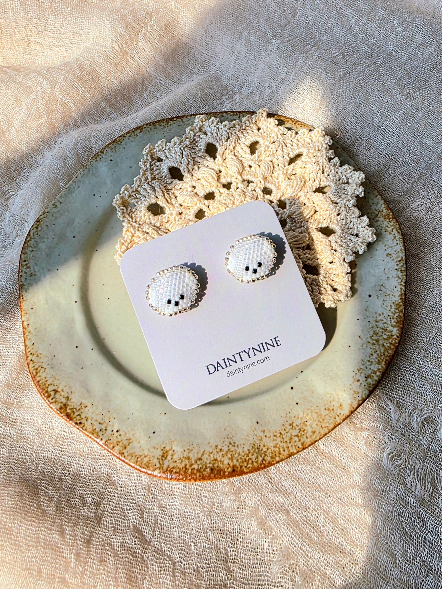 Bichon frise stud earrings on card