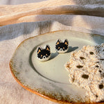Black shiba inu stud earrings left