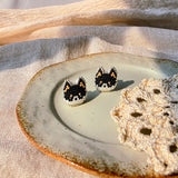Black shiba inu stud earrings left