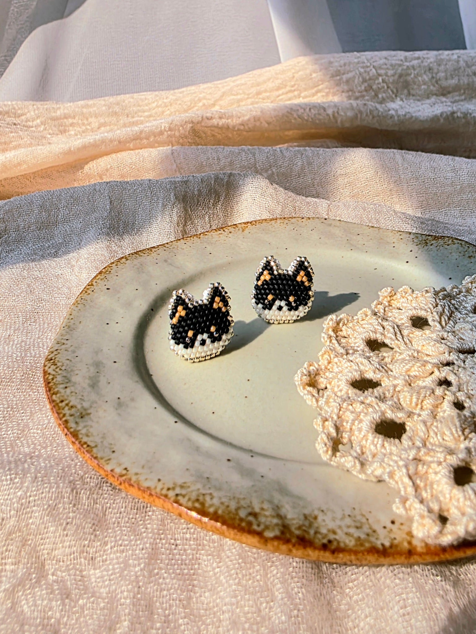 Black shiba inu stud earrings left