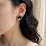 Black shiba inu stud earrings on model