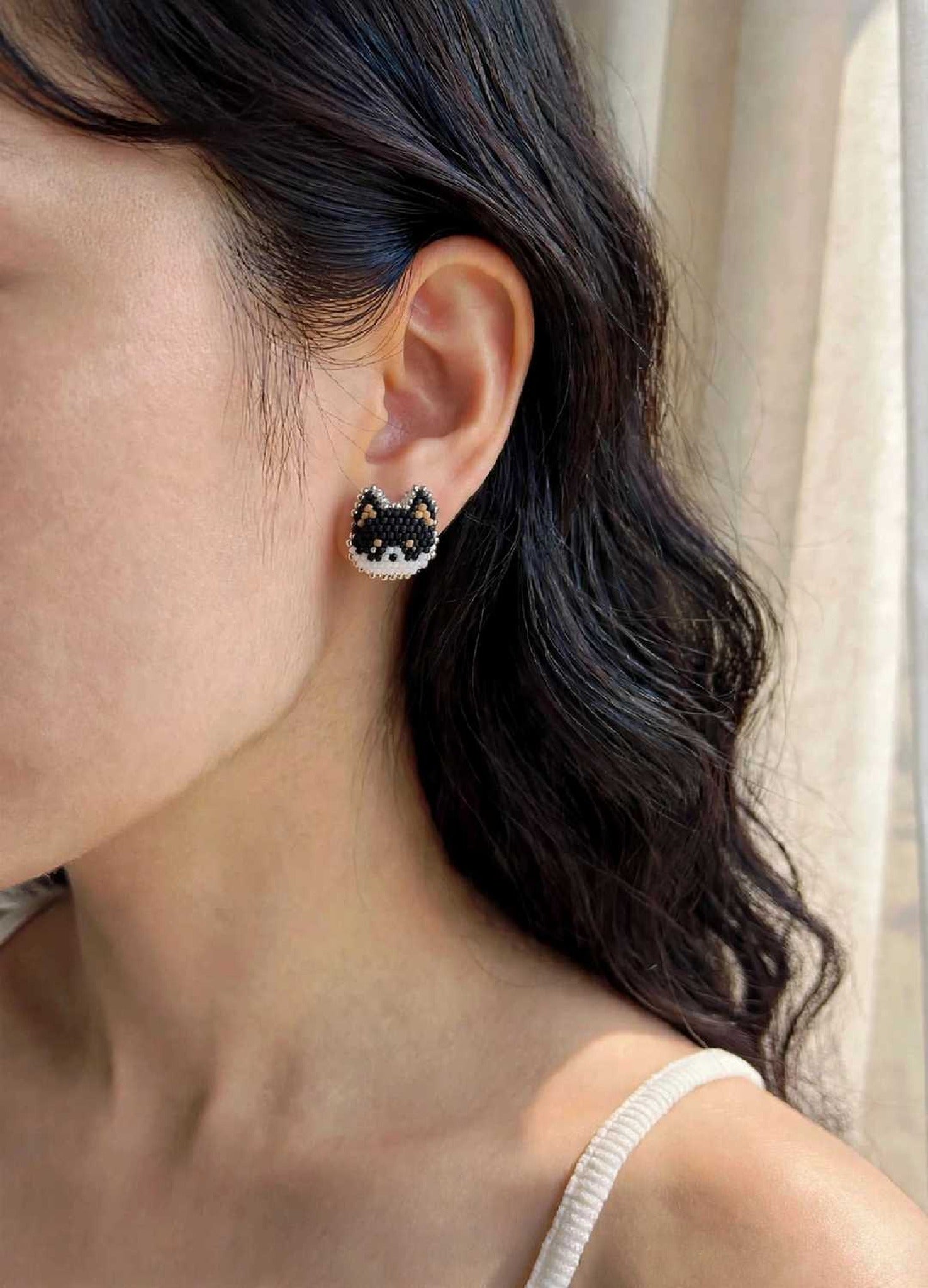 Black shiba inu stud earrings on model