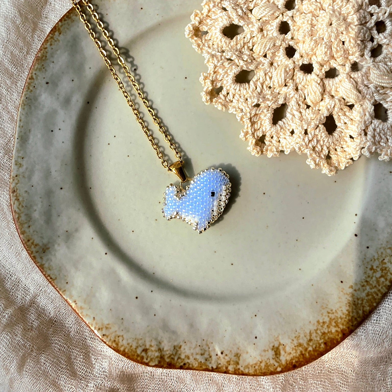 Blue whale necklace left
