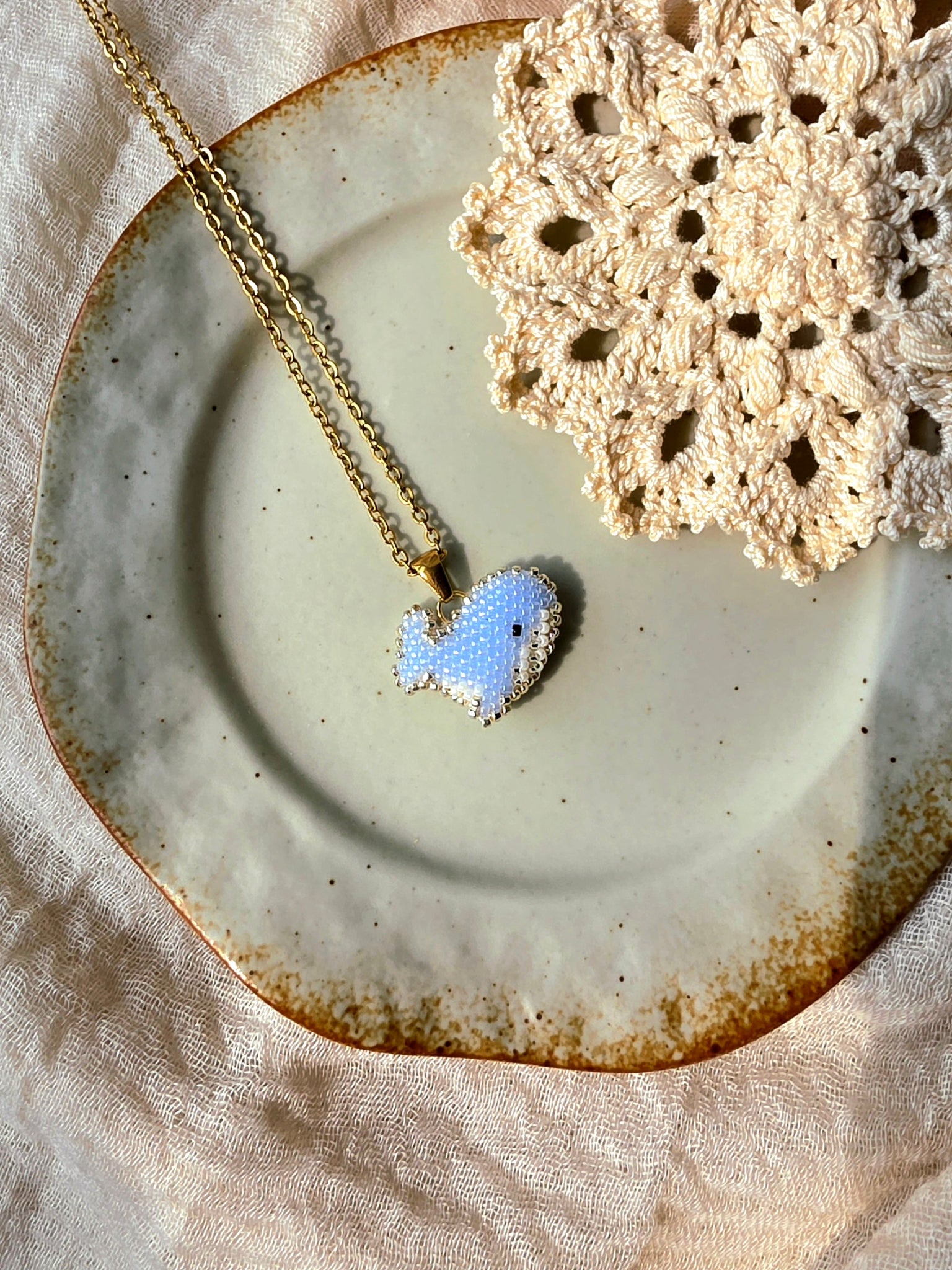 Blue whale necklace left