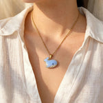 Blue whale necklace on model