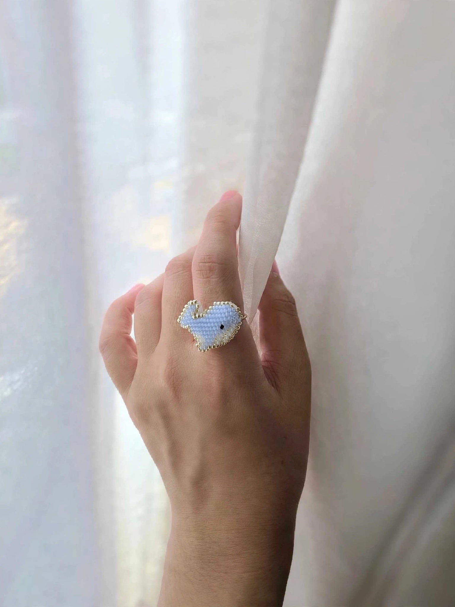Blue whale ring on model