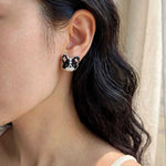 Border collie stud earrings on model