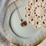 Brown bear necklace left